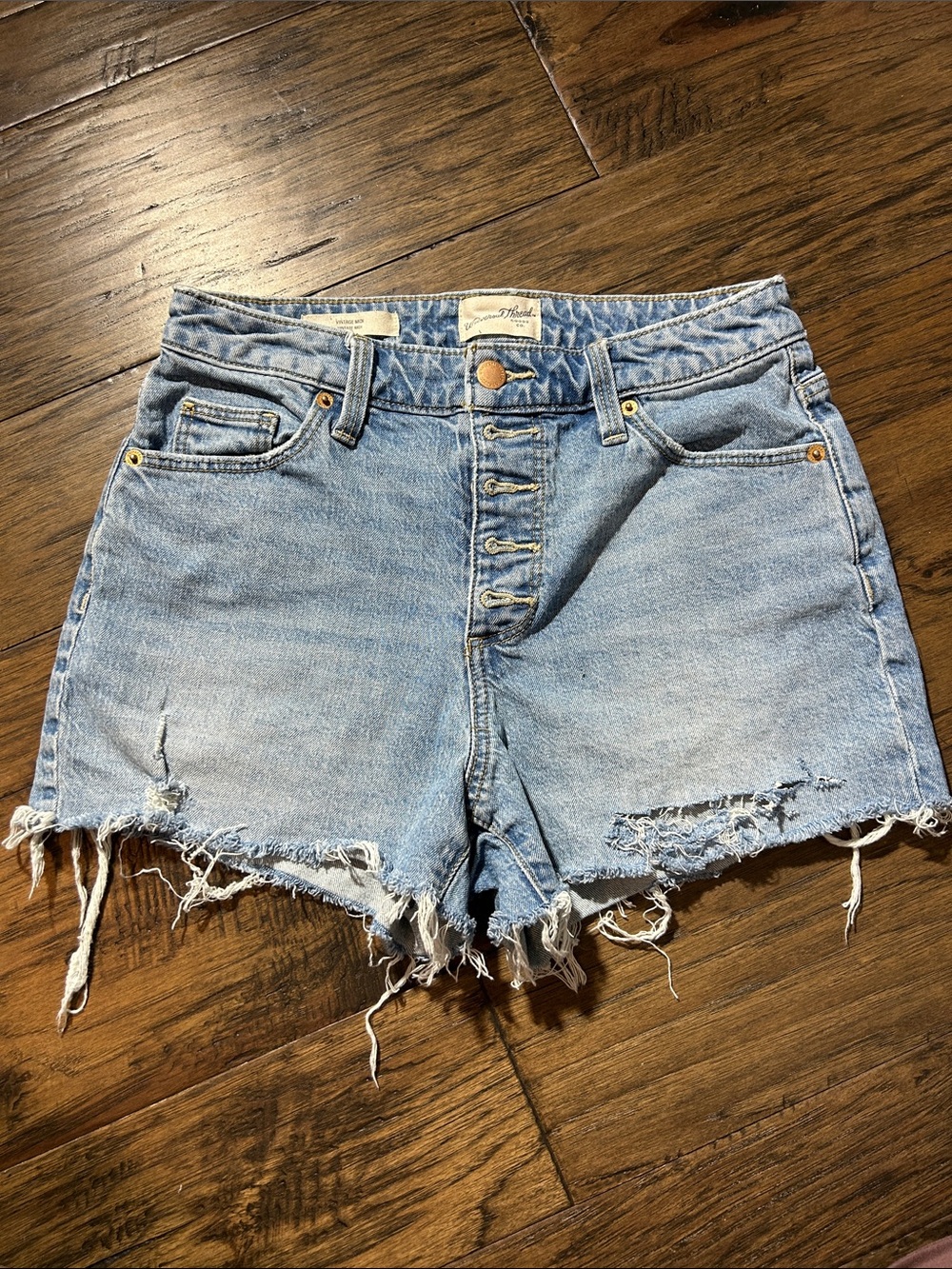 High-Rise Light Blue Distressed Denim Shorts